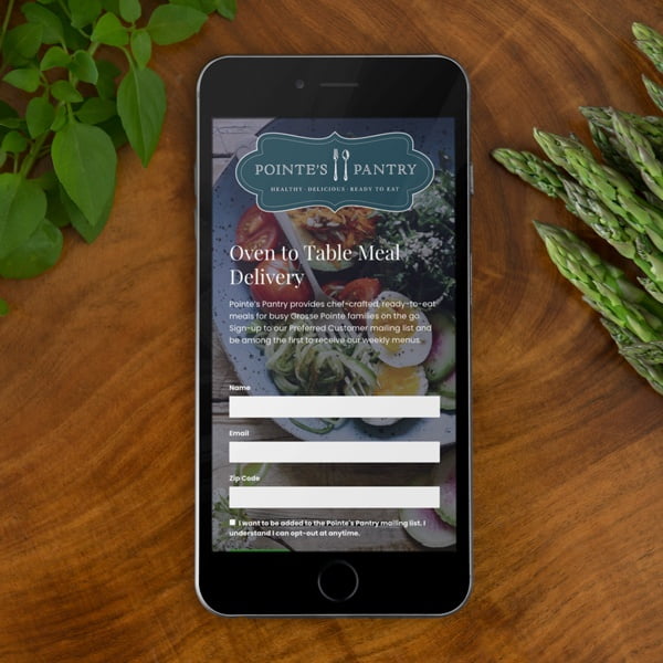 black iphone 6 on cooking table top shot pointes pantry
