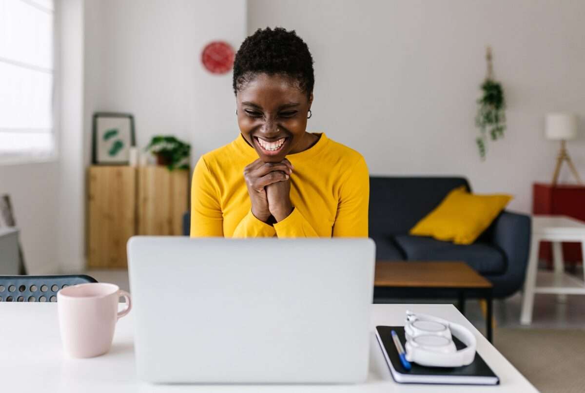 Why Your E-Commerce Website Isn’t Making Sales (And 8 Things You Can Do About It) 8 Excited young african woman celebrating success looking at laptop screen