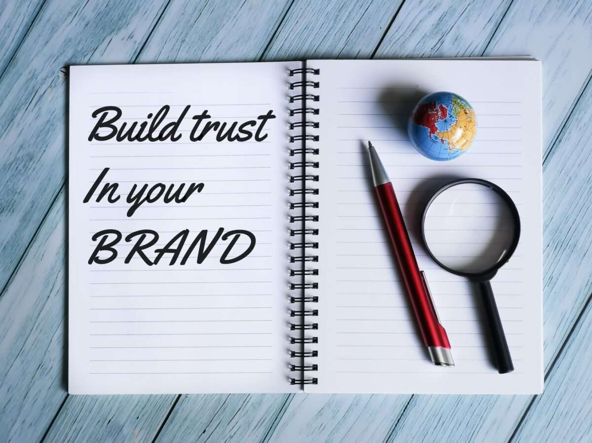 Why Your E-Commerce Website Isn’t Making Sales (And 8 Things You Can Do About It) 5 notebook written build trust in your brand