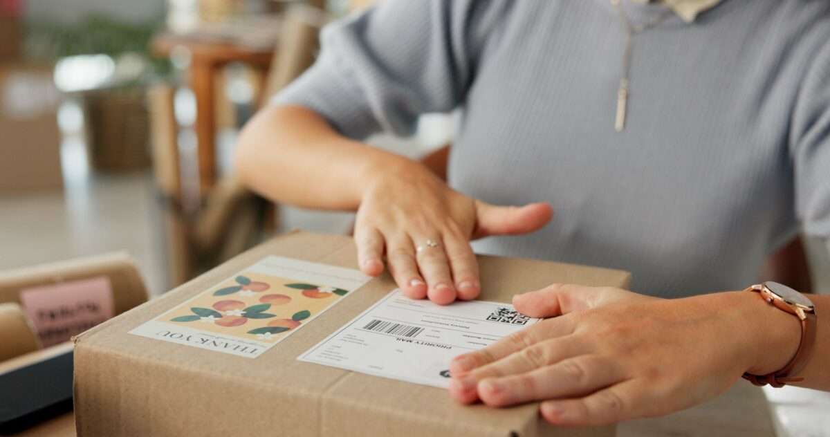 Why Your E-Commerce Website Isn’t Making Sales (And 8 Things You Can Do About It) 1 Woman, hands and package label for delivery of e commerce order, shipping information and courier.