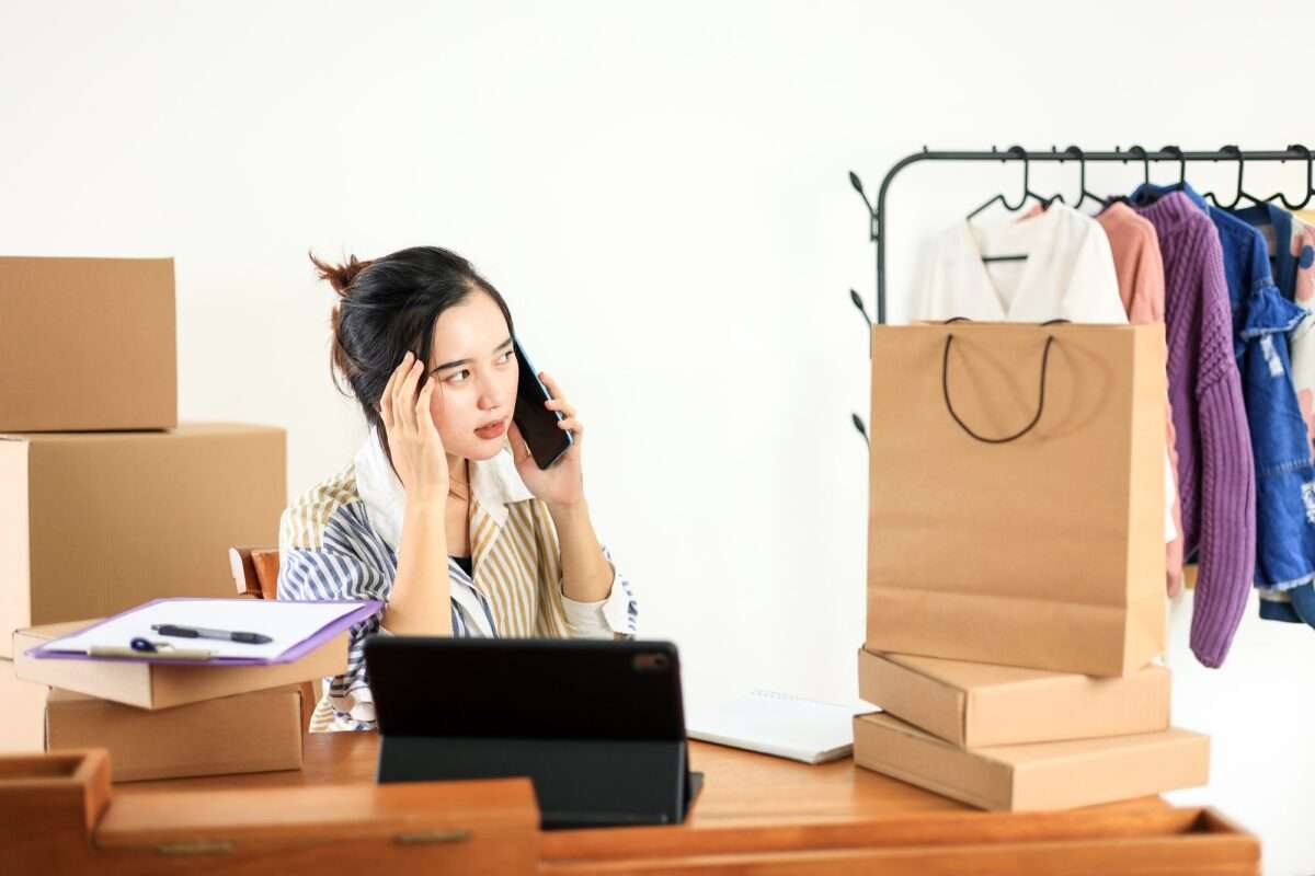 10 Ways DIY Websites Sabotage Small Businesses (And How to Avoid It) 9 Thoughtfull Asian Female Online Shop Bussiness Owner Busy on Phone