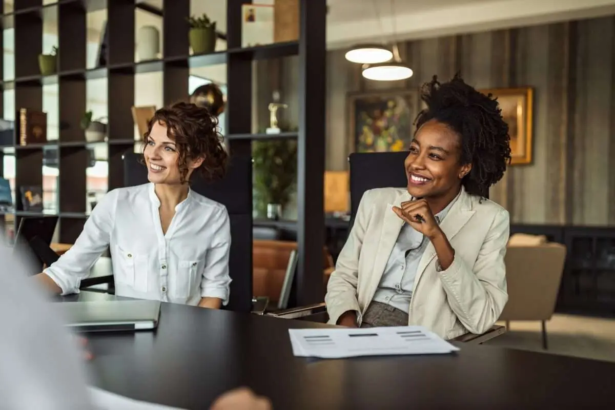 Two women Looking beautiful, showing side profile discussing content promotion strategies